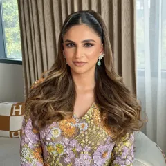 A frontal view of the sleek half-ponytail, showing the clean center part and how it keeps hair away from the face while showcasing length.