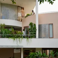 A view of the home's multi-level balconies, where architecture and landscape merge. We design these outdoor spaces as extensions of the interior living areas, encouraging an indoor-outdoor lifestyle.