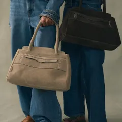 An exploration of silhouette and material with our Penny Carryall bags in sumptuous suede. I designed these to be a modern, unisex classic, combining a structured form with the soft, yielding texture of premium suede for a piece of everyday luxury.
