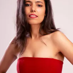 A close-up beauty shot in the red dress, highlighting my features and suitability for campaigns that require a strong facial presence.