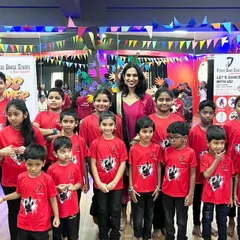 A proud group photo after a successful kids summer camp showcase. Look at all those happy, confident faces ready for their performance.