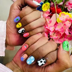 A close-up view of the detailed hand-painted nail art. Notice the clean lines and vibrant colors, which are signs of a professional application.