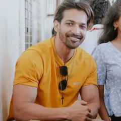 A warm, smiling portrait of actor Harshvardhan Rane, taken during a casual event session.