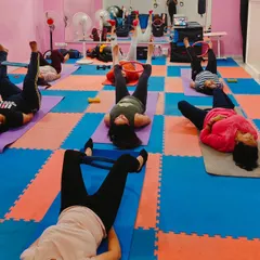 Using resistance bands during our Pilates session to intensify the workout and target specific muscle groups in the legs and glutes.