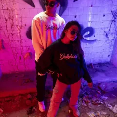 This image demonstrates my approach to urban streetwear photography. By using bold, contrasting colored lights and a gritty location, I create a dynamic and energetic vibe that makes the apparel feel current and authentic.