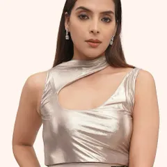 This is a perfect example of editorial makeup for a high-fashion brand. The look is clean and modern, with a focus on flawless, radiant skin that complements the metallic fabric of the outfit. It's about creating a subtle pop that elevates the entire aesthetic.