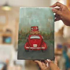 Our "Wanderlust on Wood" series captures the spirit of travel. This piece, featuring a classic red car packed for an adventure, is hand-painted on a wooden panel, perfect for the travel soul.
