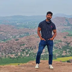 The view from Anjanadri Hill in Hampi, believed to be the birthplace of Lord Hanuman. The landscape of paddy fields and boulders is breathtaking.