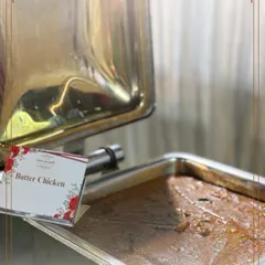 Our signature Butter Chicken is a timeless classic. This close-up shows the rich, velvety texture of the gravy, a result of slow cooking and the finest ingredients.