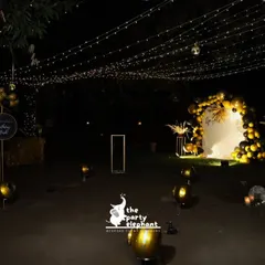 For this milestone 40th birthday, I transformed an outdoor space into a luxe, atmospheric lounge. A canopy of fairy lights, a dramatic black and gold balloon arch, and scattered floor balloons created a sophisticated and magical setting for an evening celebration.