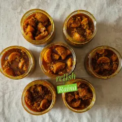 Here are several jars of my spicy amla pickle, ready for my customers. I make many batches of this throughout the winter when fresh green amla is abundant. It's a tangy and medium-spicy pickle made without any preservatives.
