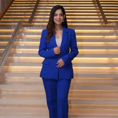 Standing tall and ready. This look is perfect for hosting a business conference or tech summit, where the attire needs to be sharp, stylish, and professional.