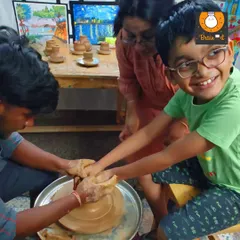 Look at that smile! The pottery wheel is a magical experience that combines sensory input with the thrill of creation. It’s a fantastic way for kids to develop focus and see their ideas take shape right before their eyes.