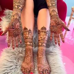 Full coverage for the bride, from hands to feet. This design features royal elephants and palace architecture, perfect for a grand wedding theme.