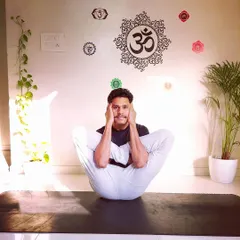 An intense seated posture that requires deep hip opening and flexibility. This asana, practiced in my home studio, demonstrates the level of dedication I bring to my personal practice and my online classes.