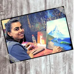 A student working on a beautiful landscape painting with acrylics on canvas. Our classes provide a serene environment to focus on your art.