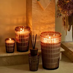 The Royal Mirage collection is a masterpiece of geometric beauty. The cut-glass lattice glows like a dusk-lit palace, housing our signature Oud Bazaar fragrance. This set, featuring candles of various sizes and a matching reed diffuser, creates a complete sanctuary of opulence.