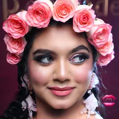 This shot captures the playful and happy side of the bride. The makeup is designed to look beautiful both in person and in photographs, with a focus on enhancing her natural features.