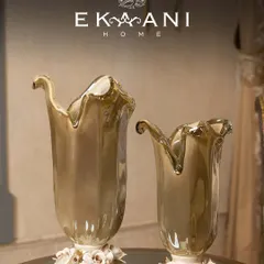 Crafted in Murano, admired everywhere. These vases, with their flowing forms and delicate porcelain rose bases, blur the line between decor and art, bringing a touch of Italian luxury to your home.