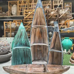 For decor that's both functional and full of personality. Our reclaimed wooden boat shelves are a quirky, nautical-inspired way to display your favorite books and treasures, adding a touch of coastal charm to any room.