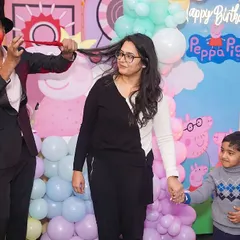 Our entertainment options keep guests of all ages captivated. Here, a professional magician performs an amazing trick, delighting both children and adults during a Peppa Pig themed birthday party.