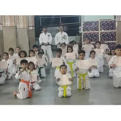 Students from our Seawoods branch proudly display their certificates after their belt achievement exam.