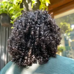 A view from the back, showing the incredible texture and definition. This is a perfect example of well-cared-for coily hair.