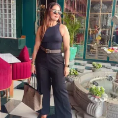 This is what I call power dressing. A sharp, all-black ensemble with a defined silhouette that's perfect for making a strong impression. This look combines a classic Zara top with Michael Kors and Coach accessories for effortless authority.