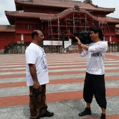 During a filming session in Okinawa, with the historic Shuri Castle in the background. I am often asked to share my knowledge of traditional karate with international audiences.