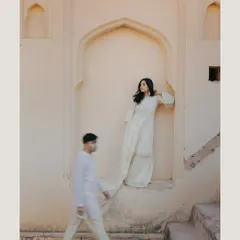 An artistic motion-blur shot in Jaipur, capturing the dynamic between stillness and movement. This creative technique adds a story-like quality to the pre-wedding portrait.