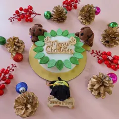 Our Christmas cake is decorated with a festive wreath and pup-friendly ornaments. We also offer doggo eggnog and wholesome pies for a complete holiday feast.