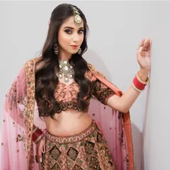 This full-length view showcases a complete bridal ensemble with a soft, romantic feel. Our training emphasizes how to harmonize makeup and hair with the outfit and jewelry.