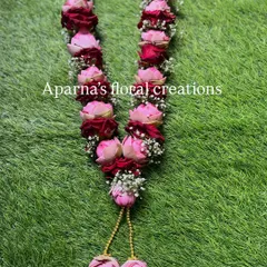 I combined pink lotus buds with deep red roses in this custom varmala. The contrast in color and texture makes it a unique and eye-catching piece for any ceremony.