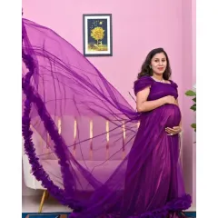 Make a statement with this magnificent purple tulle gown. I love capturing dynamic shots like this, where we let the long, flowing train fly, creating a sense of magic and movement.
