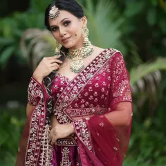 A full-length view of a traditional bridal look created during a class demonstration. Notice the rich velvet lehenga with detailed embroidery, paired with a statement kundan necklace. I teach my students how to style the entire look, not just the makeup.