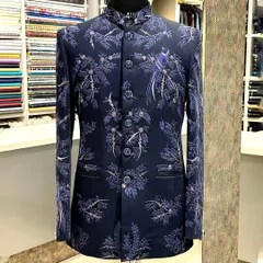 I love blending tradition with a personal touch. This custom navy blue bandhgala features delicate, hand-done bird and branch embroidery, creating a look that is both regal and unique for any formal occasion.