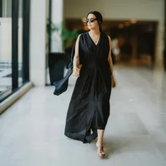 Neha Dhupia walking through the venue. This shot shows how the hairstyle moves and holds up in a real-world event setting, looking polished and secure.
