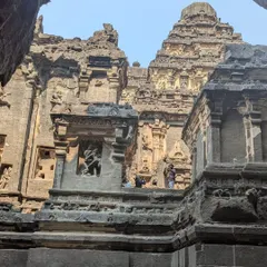 A closer look at the intricate carvings and architectural layers of the Ellora caves. Every surface tells a story, a testament to the skill of ancient artisans.