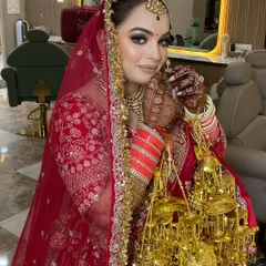A classic red bridal lehenga deserves a timeless makeup look. For this bride, I focused on a flawless base, defined eyes, and a confident pose, ensuring she felt as incredible as she looked on her big day.