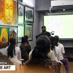 A wide view of our Diploma in Fine Art class, where students are engaged in a digital study session surrounded by inspiring artwork on the walls.