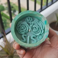 A special Rakhi-themed candle for a sister. This one has "SIS" in wax letters and is decorated with beautiful teal-colored wax roses. You can customize it for your sister or bhabhi.