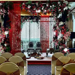 A view of the wedding mandap from the guest's perspective. I ensure the decor looks beautiful from every angle, creating a wonderful experience for everyone attending.