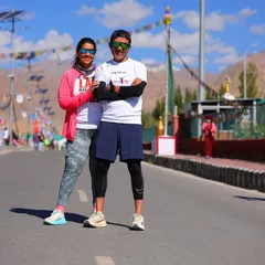 Posing with a finisher after the Ladakh Marathon. Running at the roof of the world is an incredible achievement, and I'm proud to guide athletes to this finish line.