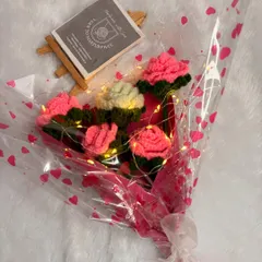 My LED light rose bouquet shown with my brand card. The lights add a magical touch, making it a perfect gift for anniversaries, birthdays, or romantic occasions.