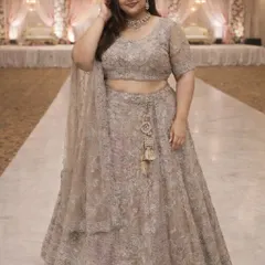 This pose highlights the flattering fit of the embroidered blouse and the graceful fall of the lehenga skirt. It’s a testament that designer wear is for every body.