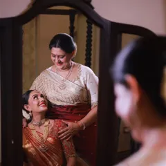 A precious moment between a bride and her mother, captured in the mirror. Creating a calm and happy environment for these memories to happen is a key part of my service.
