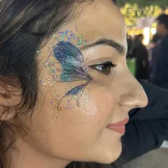 A beautiful blue and green glitter butterfly wing. This design shows how you can use loose cosmetic glitter to create a stunning, multi-dimensional effect that catches the light perfectly.