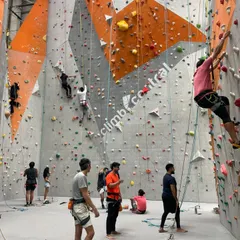 The gym is buzzing with energy. Climbers are on the walls, others are belaying, and some are planning their next route. This is the supportive and active community you'll find here every day.