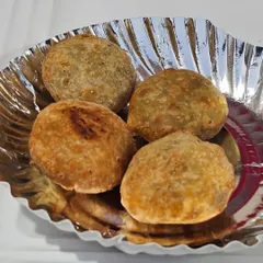 Hot and fresh kachoris, a classic savory snack. The flaky pastry and spiced filling make it an irresistible part of my Gujarati and Marwari catering menus.
