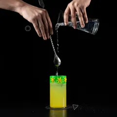 Balanced cocktails allow different flavours to shine through. Here you see the precise art of the pour, a key step in creating a layered and interesting taste profile for our Phoenix cocktail.